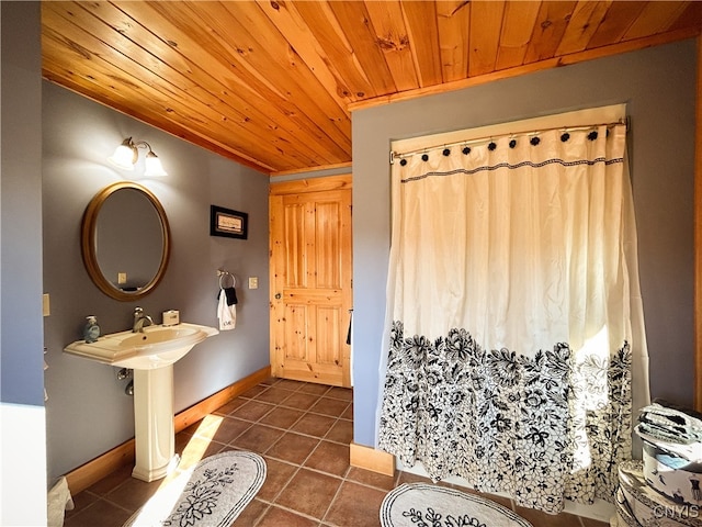 bathroom featuring wooden ceiling and tile patterned floors