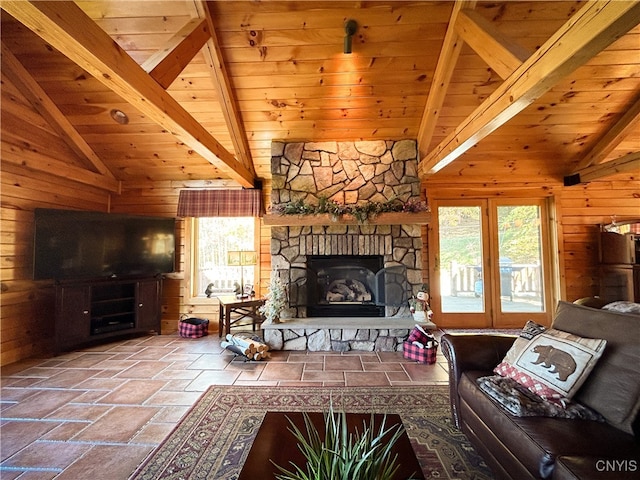 living room featuring a stone fireplace, beamed ceiling, wooden walls, and wooden ceiling