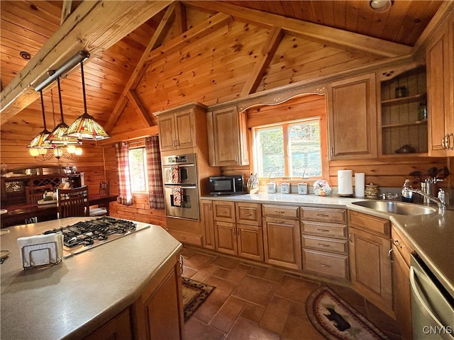 kitchen with stainless steel appliances, sink, decorative light fixtures, wood ceiling, and wooden walls