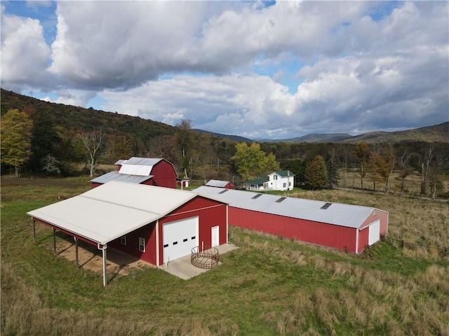 aerial view with a mountain view and a rural view