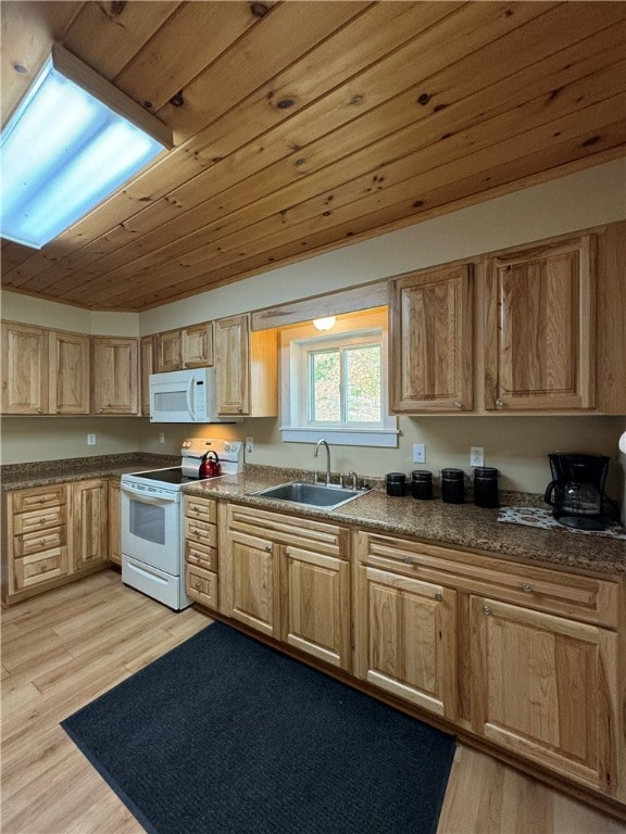 kitchen with white appliances, light hardwood / wood-style flooring, wood ceiling, and sink