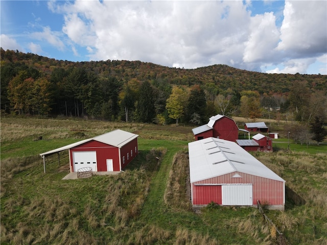 exterior space with a mountain view and a rural view