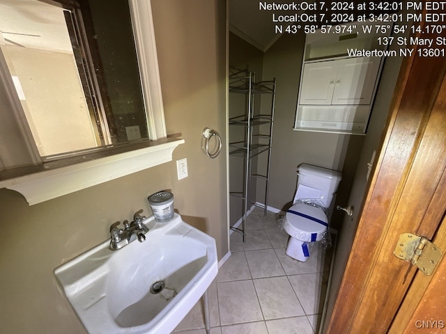 bathroom with sink, tile patterned flooring, and toilet