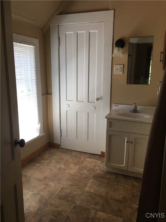 bathroom with vanity and a wealth of natural light