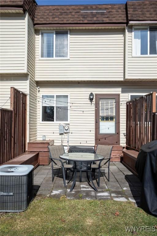 back of property featuring a patio and central AC unit