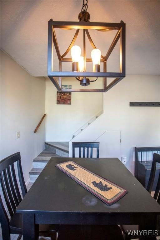 dining area with a notable chandelier