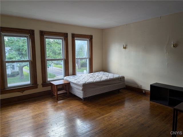 bedroom featuring dark hardwood / wood-style flooring