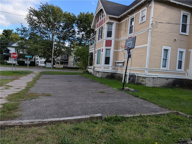 view of property exterior featuring a lawn