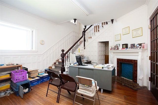 office space featuring wood-type flooring and ornamental molding