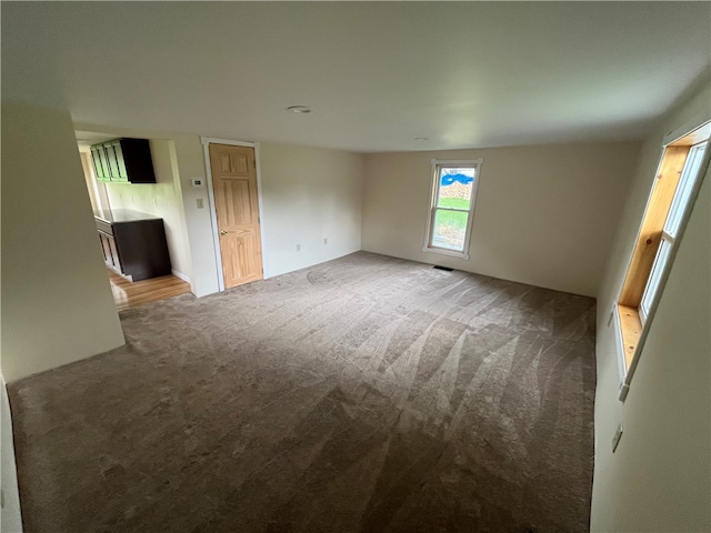 unfurnished room with carpet flooring