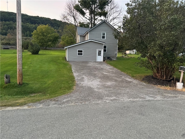 view of property exterior featuring a yard