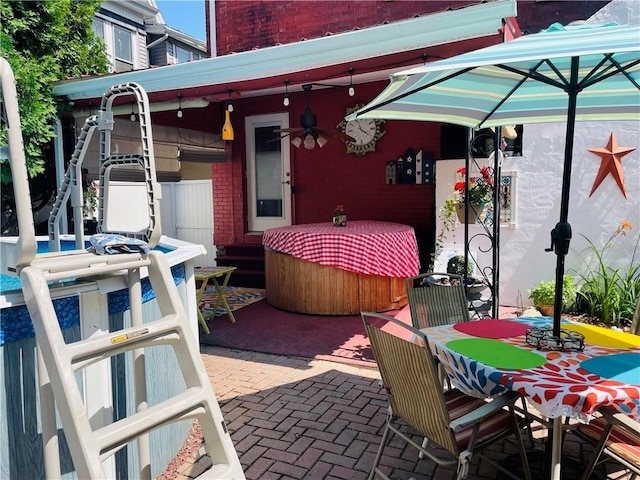 view of patio / terrace featuring ceiling fan