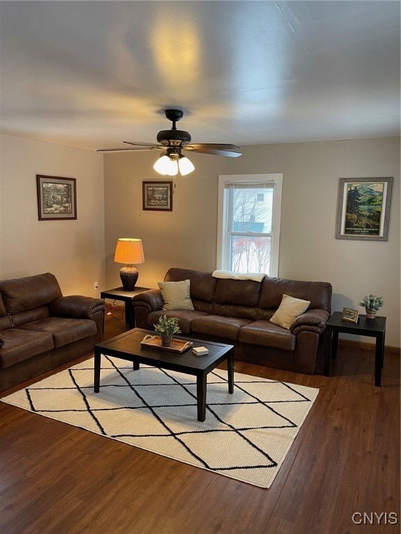 living room with light hardwood / wood-style flooring and ceiling fan