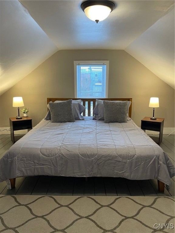 bedroom with lofted ceiling