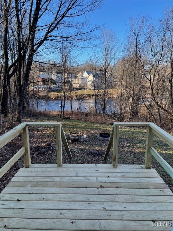 wooden deck featuring a water view