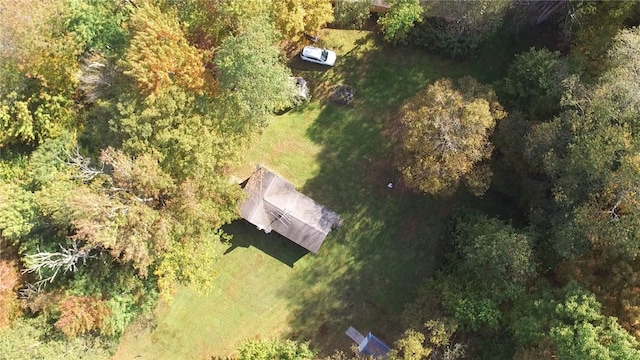 birds eye view of property with a wooded view