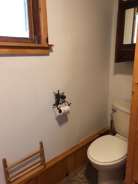 bathroom featuring tile patterned flooring and toilet