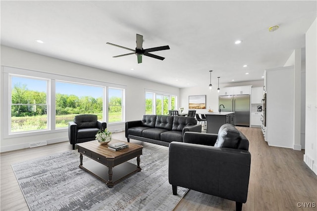 LOT58 Chillingham Way, Lysander, NY 13027 - living area with ceiling fan, recessed lighting, wood finished floors, and baseboards