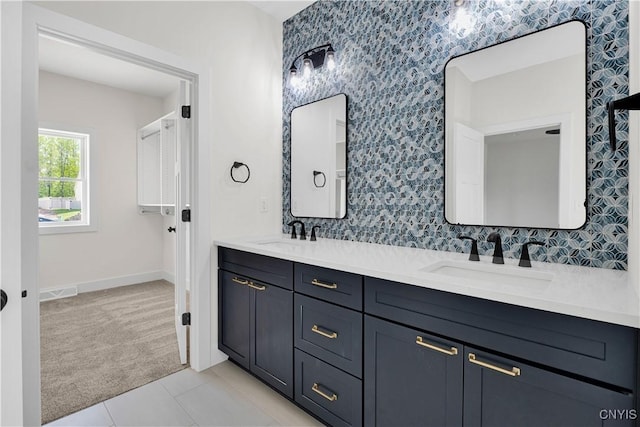 LOT58 Chillingham Way, Lysander, NY 13027 - full bath featuring double vanity, baseboards, tile patterned flooring, and decorative backsplash