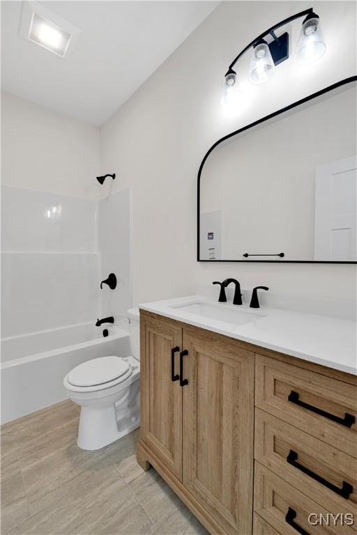 LOT58 Chillingham Way, Lysander, NY 13027 - bathroom featuring toilet, vanity, and shower / tub combination