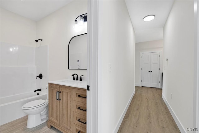 LOT58 Chillingham Way, Lysander, NY 13027 - bathroom with wood finished floors, vanity, toilet, bathtub / shower combination, and baseboards