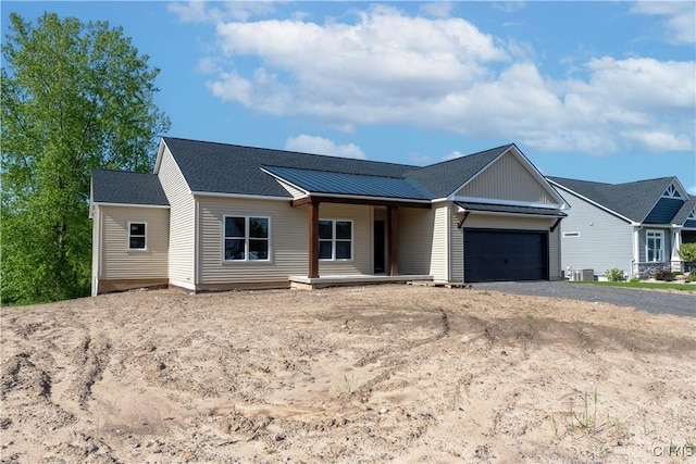 LOT58 Chillingham Way, Lysander, NY 13027 - single story home with an attached garage, driveway, covered porch, and central air condition unit