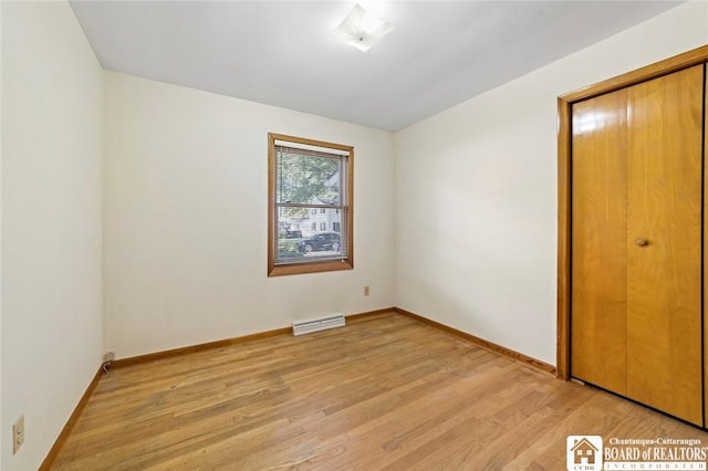 69 Cottage St Unit S, Pomfret, NY 14063 - unfurnished bedroom featuring light wood-style floors and baseboards