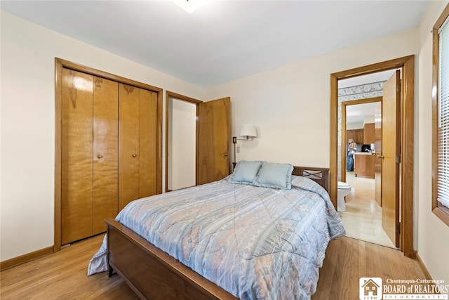 bedroom featuring a closet and light hardwood / wood-style flooring