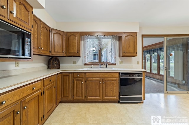 kitchen featuring black appliances and sink