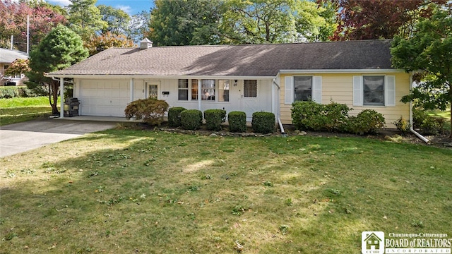 ranch-style house with a front yard and a garage