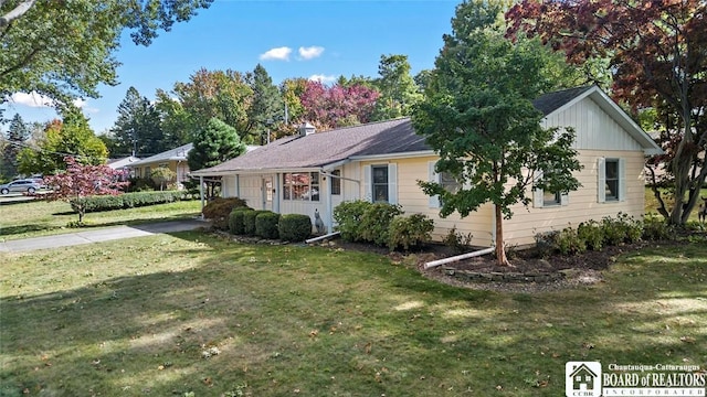 69 Cottage St Unit S, Pomfret, NY 14063 - ranch-style house featuring a front lawn, concrete driveway, and board and batten siding