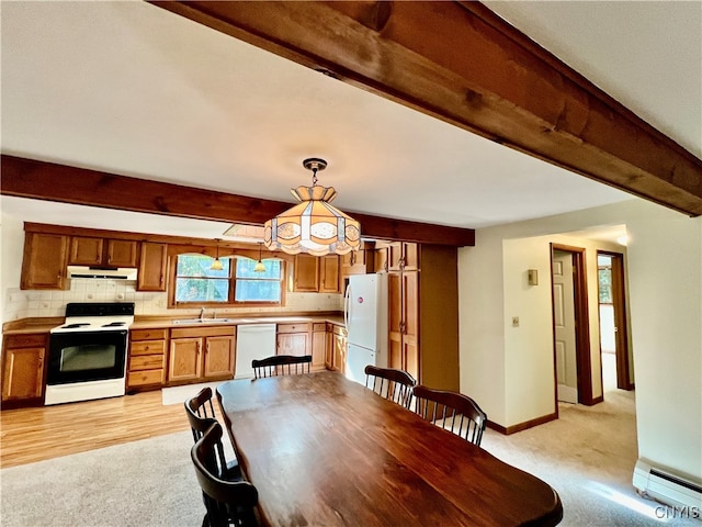 dining room featuring beamed ceiling, light hardwood / wood-style flooring, sink, and a baseboard heating unit