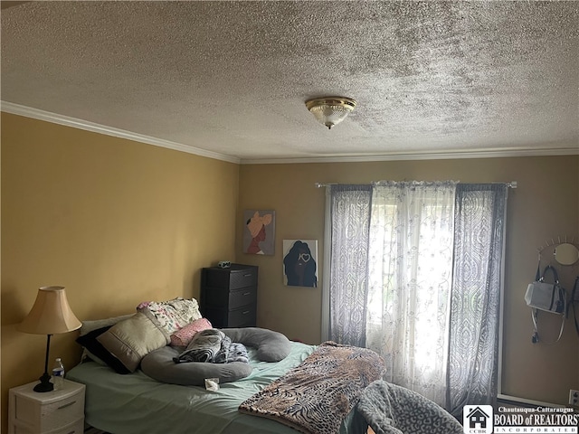 bedroom featuring ornamental molding and a textured ceiling