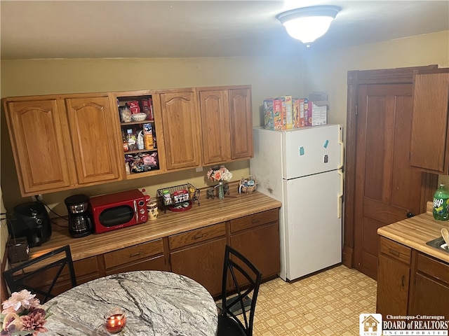 kitchen featuring white refrigerator