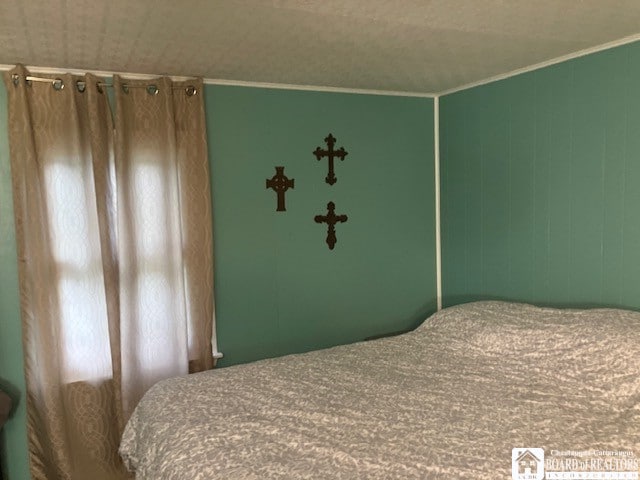 bedroom with crown molding