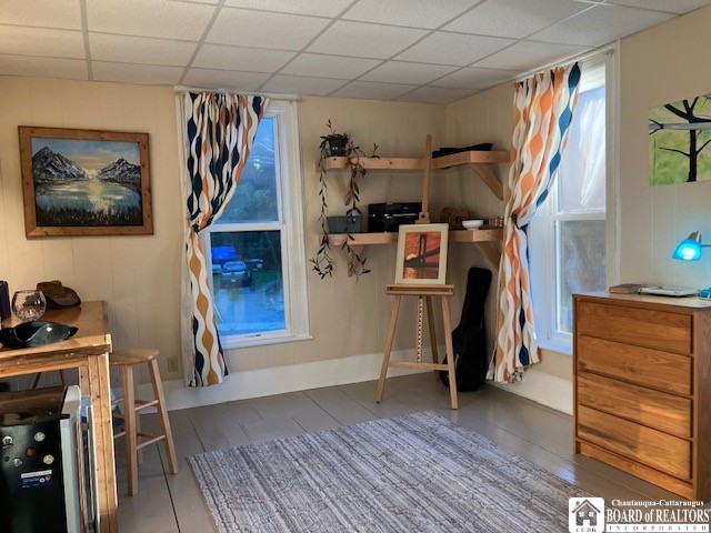 tiled bedroom with a drop ceiling