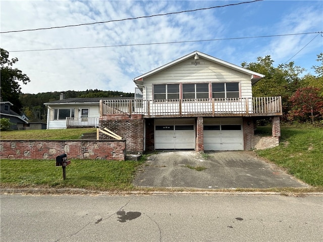 view of front of house with a garage and a wooden deck