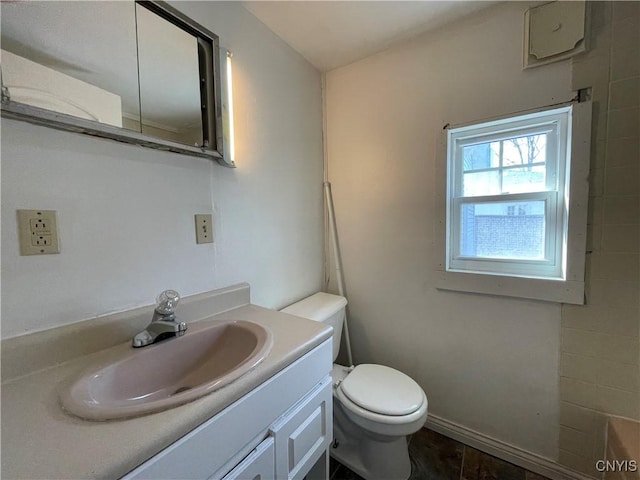 bathroom featuring vanity and toilet