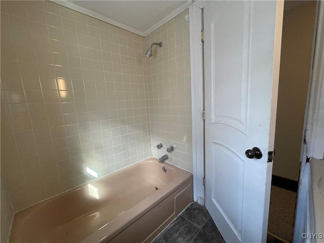 bathroom with tiled shower / bath combo and ornamental molding