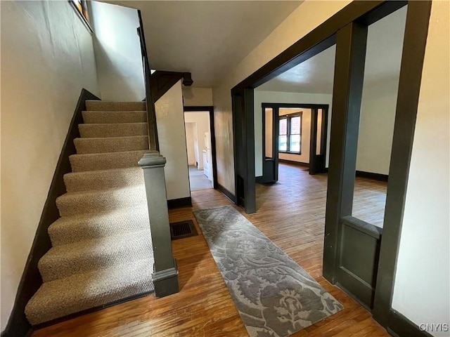 staircase featuring hardwood / wood-style floors