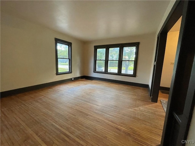 unfurnished room featuring light hardwood / wood-style floors