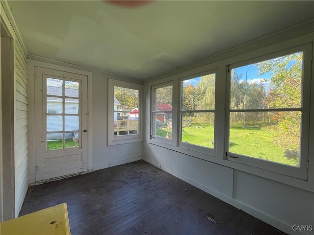 unfurnished sunroom featuring a wealth of natural light