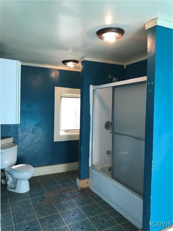 6179 State Highway 29a, Stratford, NY 13329 - bathroom with toilet and shower / bath combination with glass door