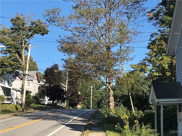 6179 State Highway 29a, Stratford, NY 13329 - view of asphalt road featuring street lights, curbs, and sidewalks