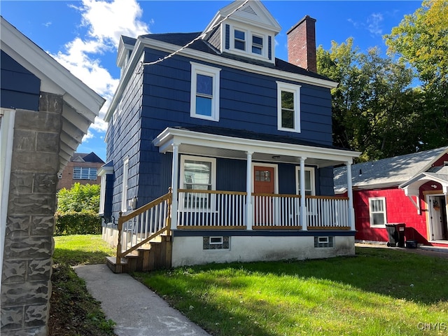 view of front of house featuring a porch and a front yard