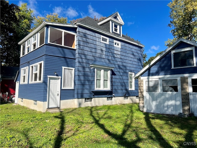 rear view of house with a lawn