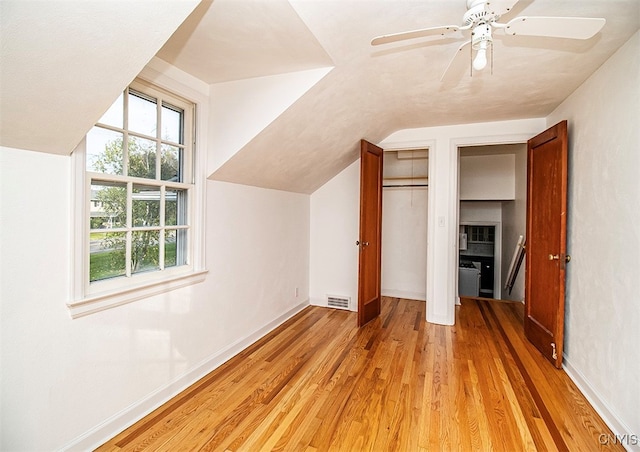 bonus room featuring lofted ceiling, ceiling fan, and light hardwood / wood-style floors