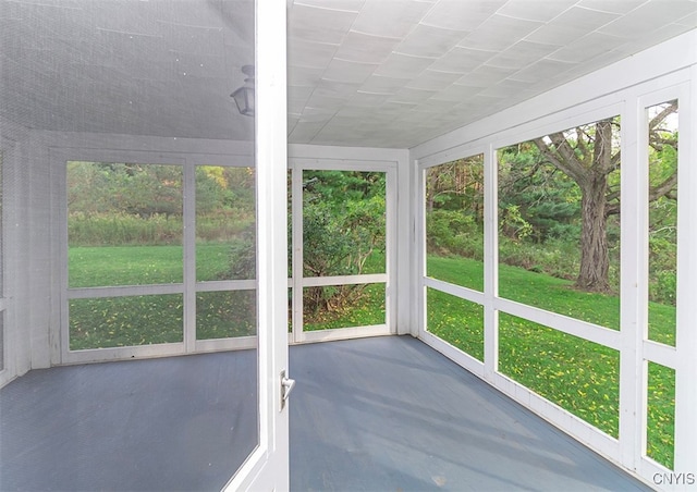 unfurnished sunroom featuring a healthy amount of sunlight