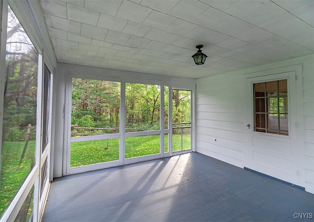 unfurnished sunroom featuring a healthy amount of sunlight