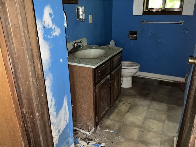 bathroom featuring toilet and vanity